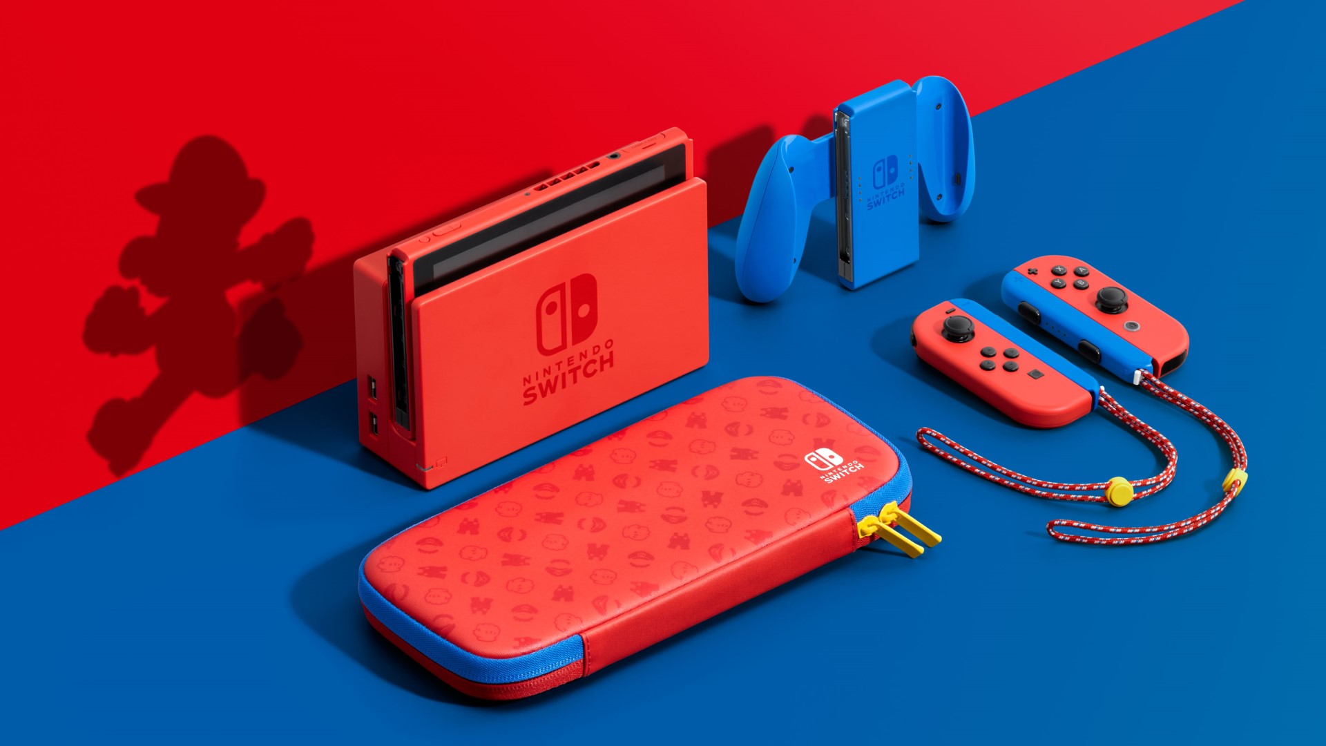 A special edition Nintendo Switch console and accessories are styled with a red and blue Mario theme. The set includes a red console dock, Joy-Con controllers in red and blue, Joy-Con straps with a Mario design, and a red carrying case with Mario-themed patterns—perfect for enjoying your favorite Nintendo Switch games. | BeTechIT