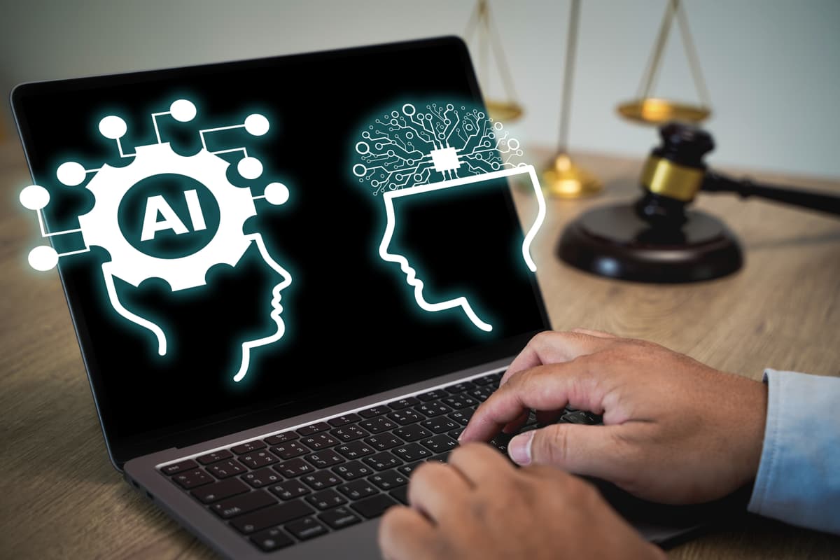 A person typing on a laptop displaying AI and human brain icons on the screen, with a gavel and justice scales in the background, symbolizing the intersection of artificial intelligence and law. | Betechit.com