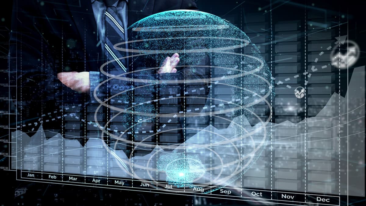 A person in a suit stands with folded arms behind a translucent globe with spiral lines, overlaid on a calendar and bar graph, symbolizing business analytics and global data trends. | Betechit.com