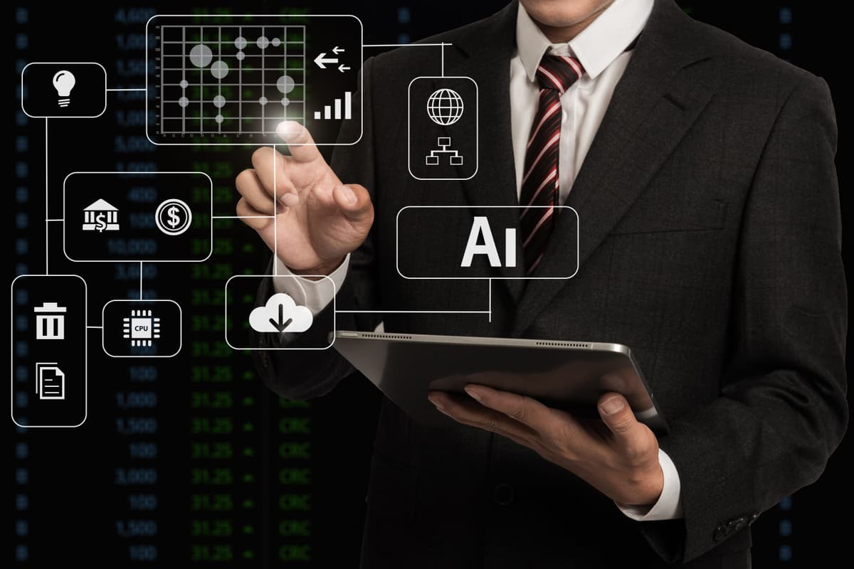 A person in a suit uses a tablet, touching digital icons related to artificial intelligence, finance, and technology, with a screen displaying data and numbers in the background. | Betechit.com