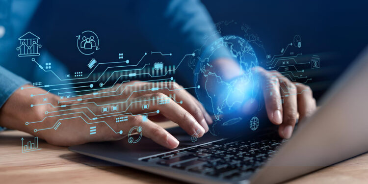 Person typing on a laptop with digital graphics showing technology, global connections, and financial icons overlaying the scene, symbolizing business technology and data transfer. | Betechit.com